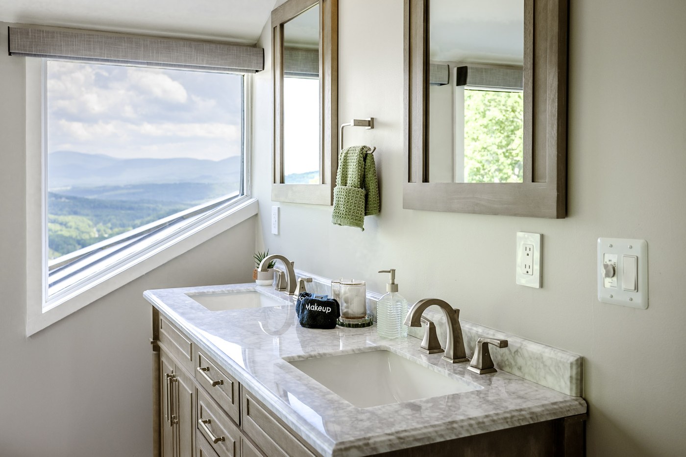Second double vanity with marble counter and dramatic Catskill mountain view